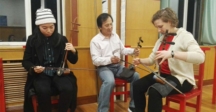 Photo of musicians playing asian instruments